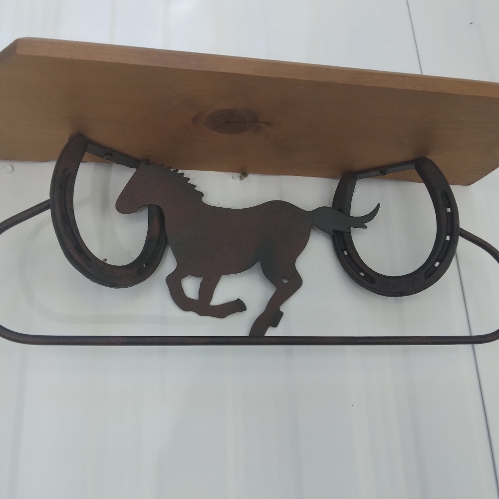 Vintage wooden shelf with metal horses/ horseshoes